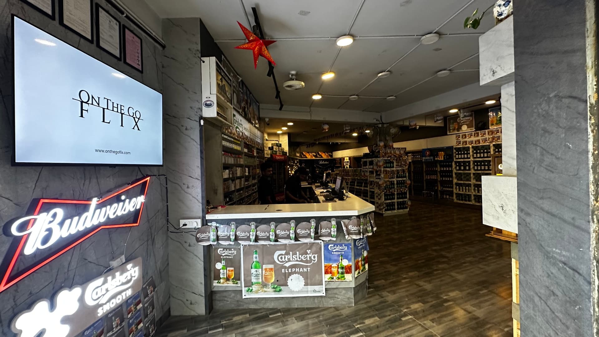 The screen placement inside A R Liquors