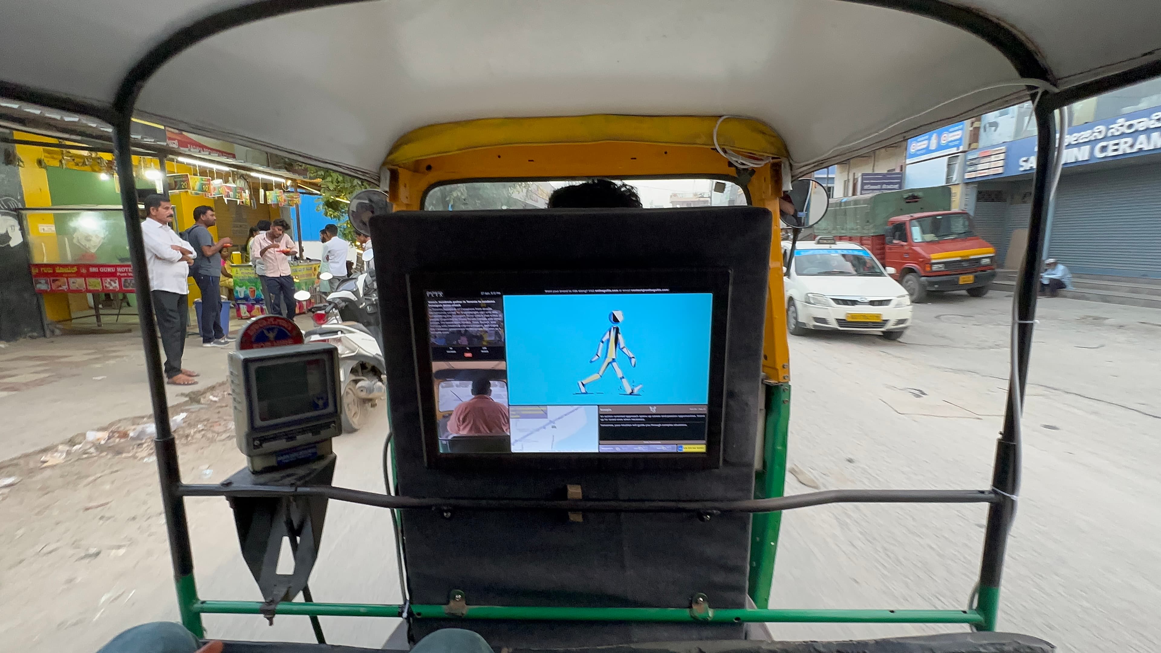 OnTheGoFlix screen placement inside an auto-rickshaw